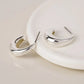 Peace of Mind - Silver Plated Curve Hoop Earrings